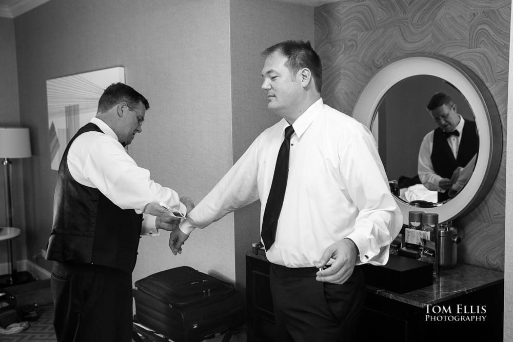 Gay couple getting into their tuxedos before the wedding ceremony